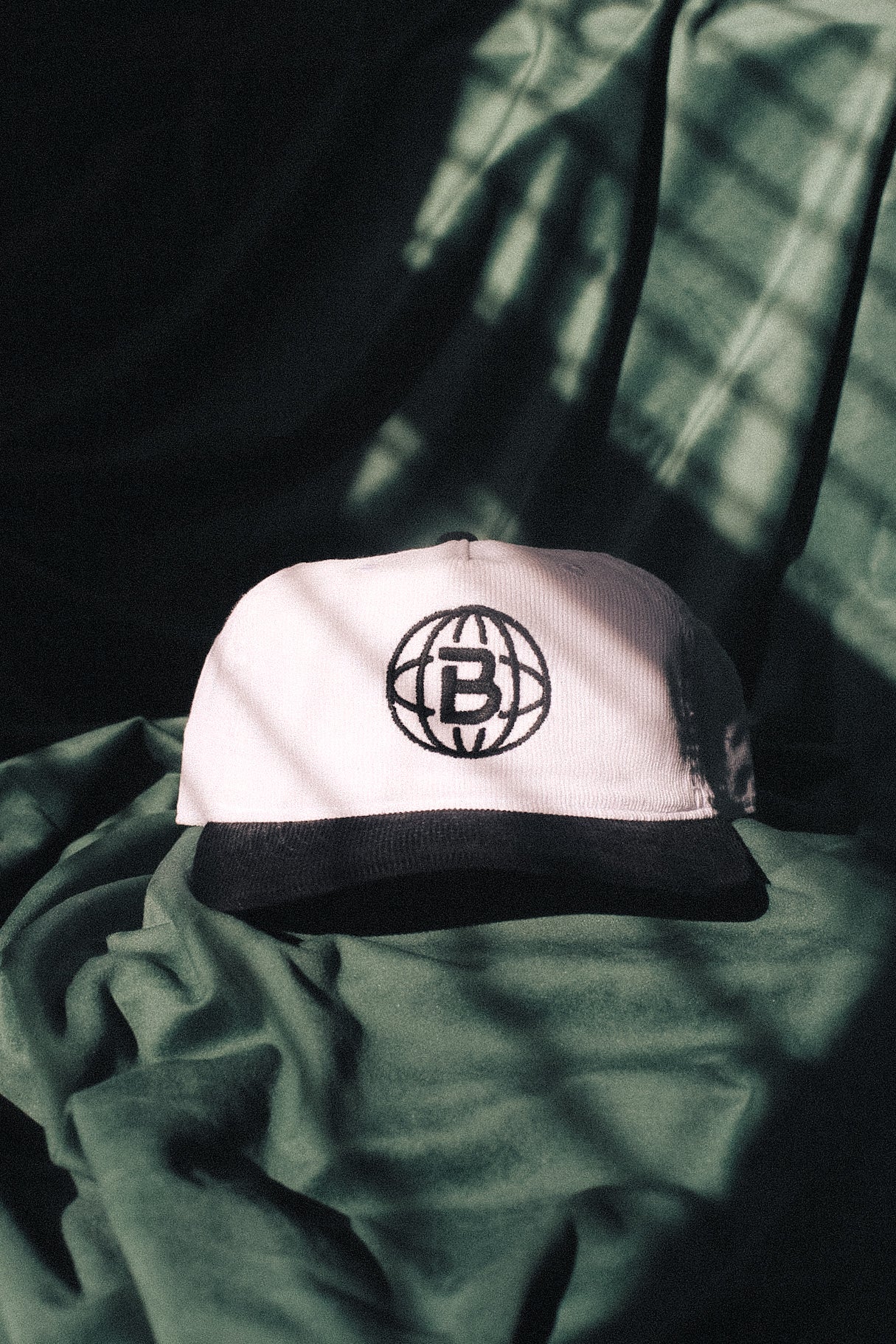 "Bellworld" corded hat